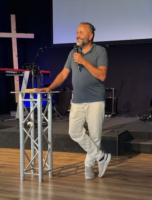 Matthias speaking on stage